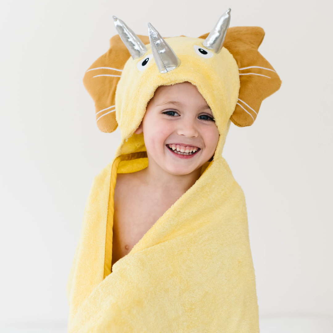 Bamboo hooded baby towel with a yellow dinosaur hood