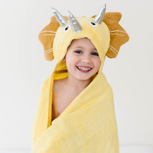 Bamboo hooded baby towel with a yellow dinosaur hood